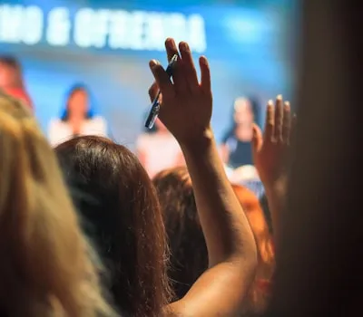 woman raising hand